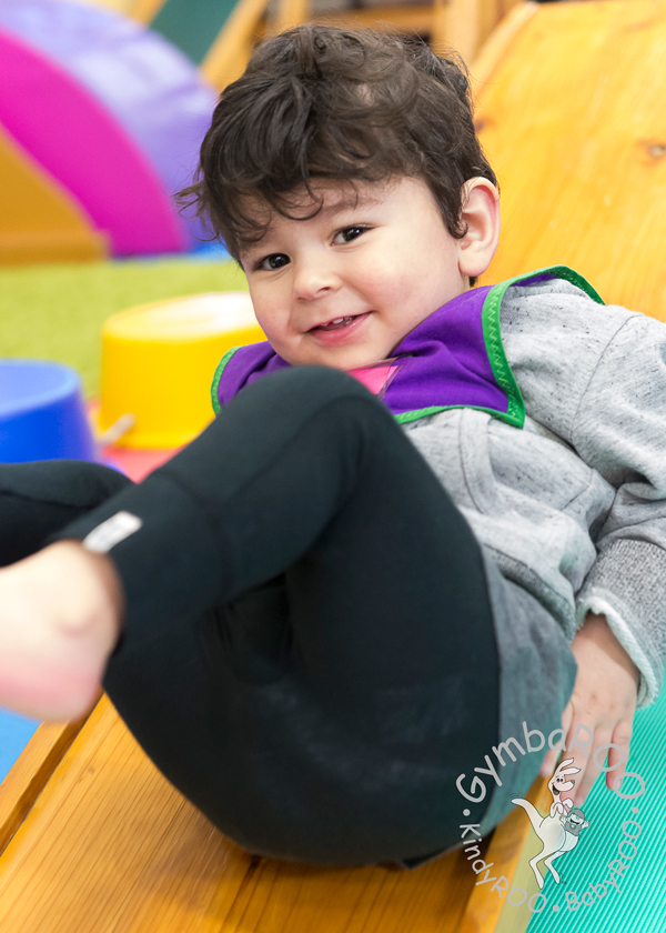 Child loving the slide at GymbaROO BabyROO