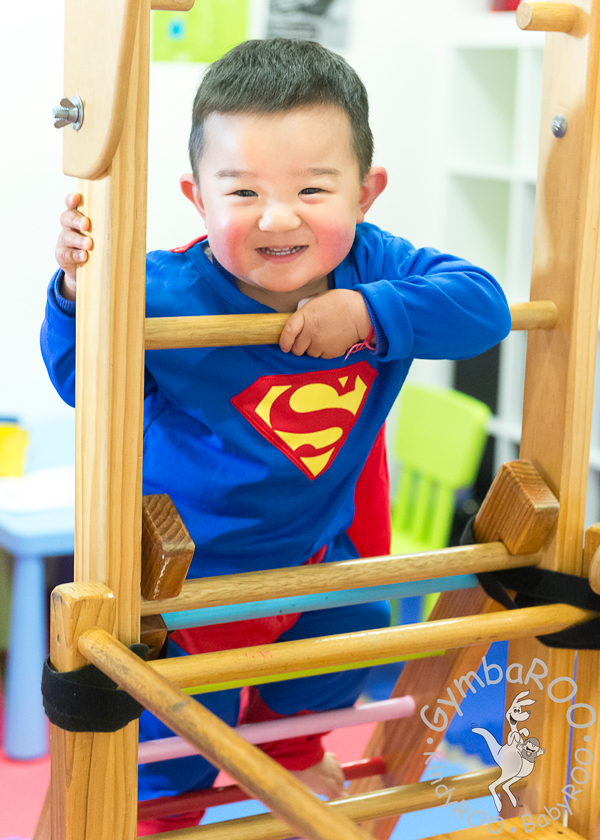 Young boy climbing a ladder at GymbaROO BabyROO