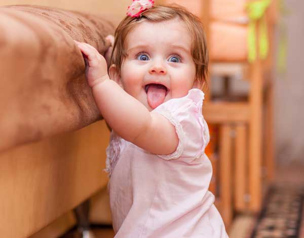 baby walking around furniture